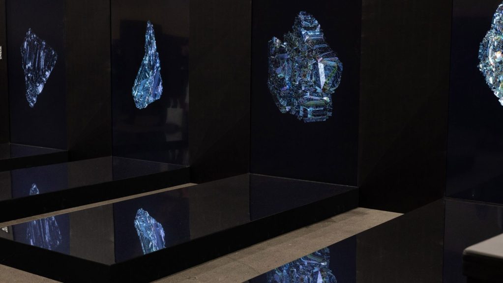 Digitally made blue crystals on a dark background